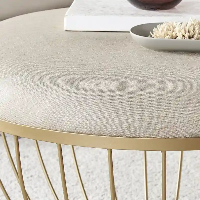 Pouf rond rembourré avec base ouverte en métal doré thermolaqué, lin ou velours