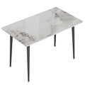 Table à manger rectangulaire avec plateau en pierre frittée et pieds effilés en métal