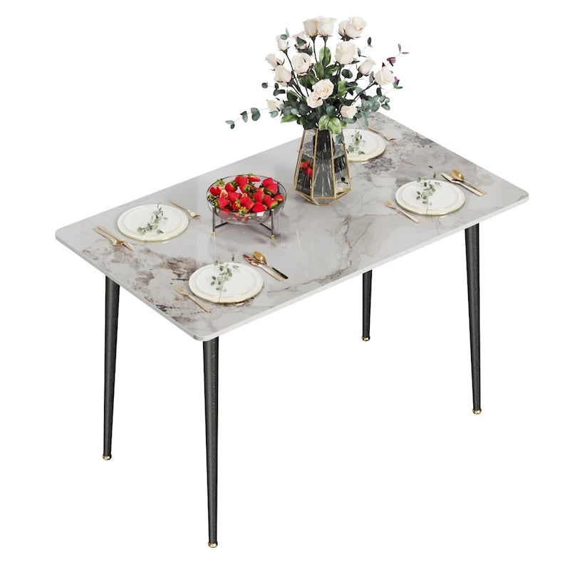 Table à manger rectangulaire avec plateau en pierre frittée et pieds effilés en métal