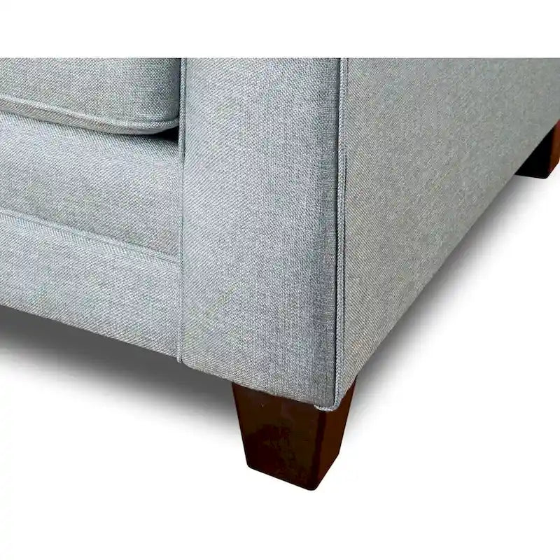 Canapé convertible avec coussins réversibles, accoudoirs arrondis et pieds fuselés, gris-bleu